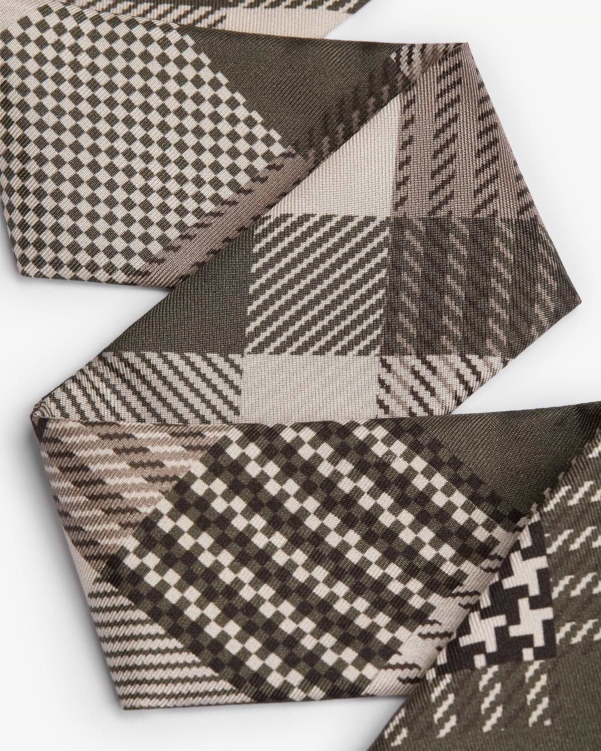 Folded green tartan silk skinny scarf showing checked and diagonal stripe patterns