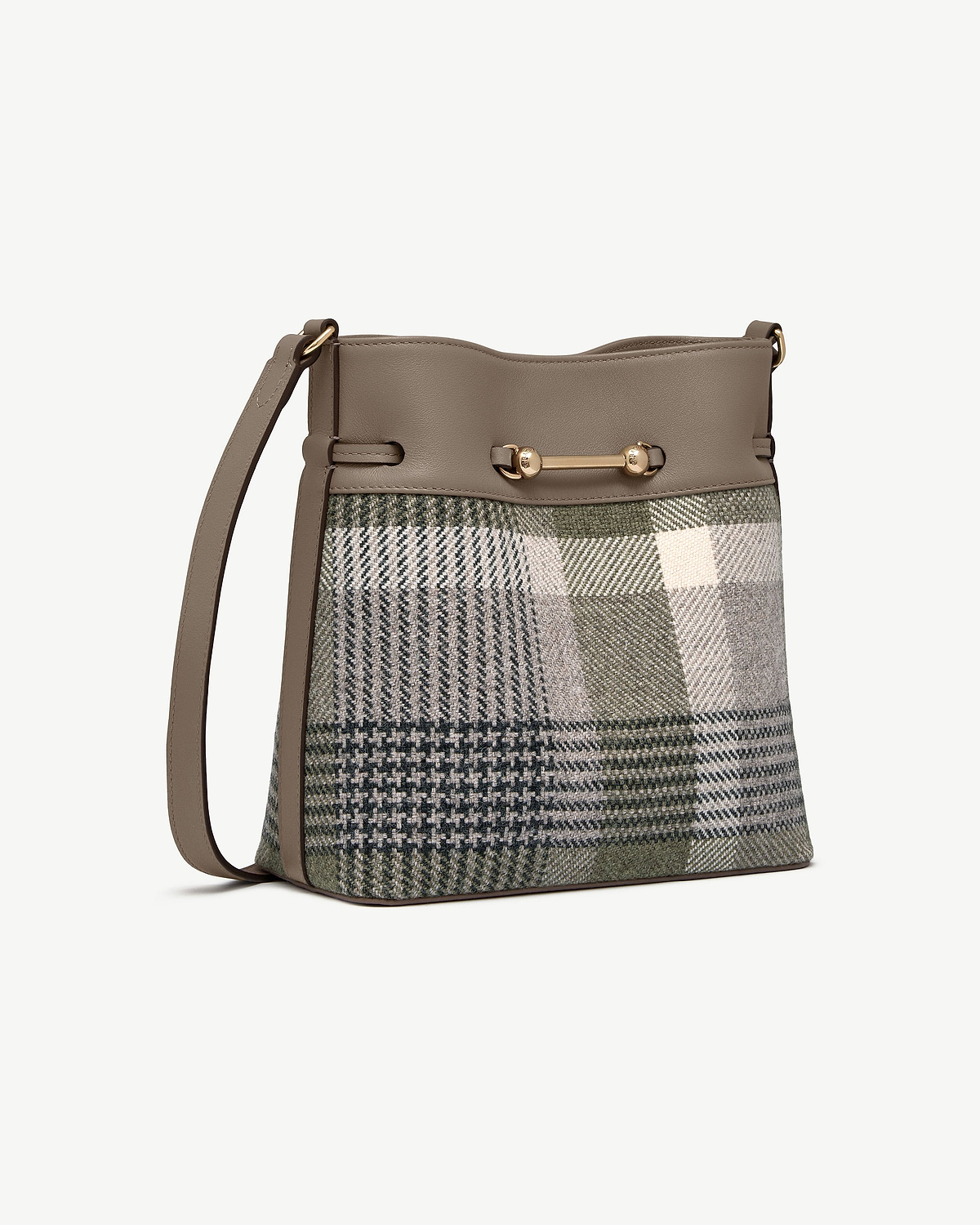 Bucket bag with tartan fabric body, taupe leather trim, gold bar hardware and shoulder strap.