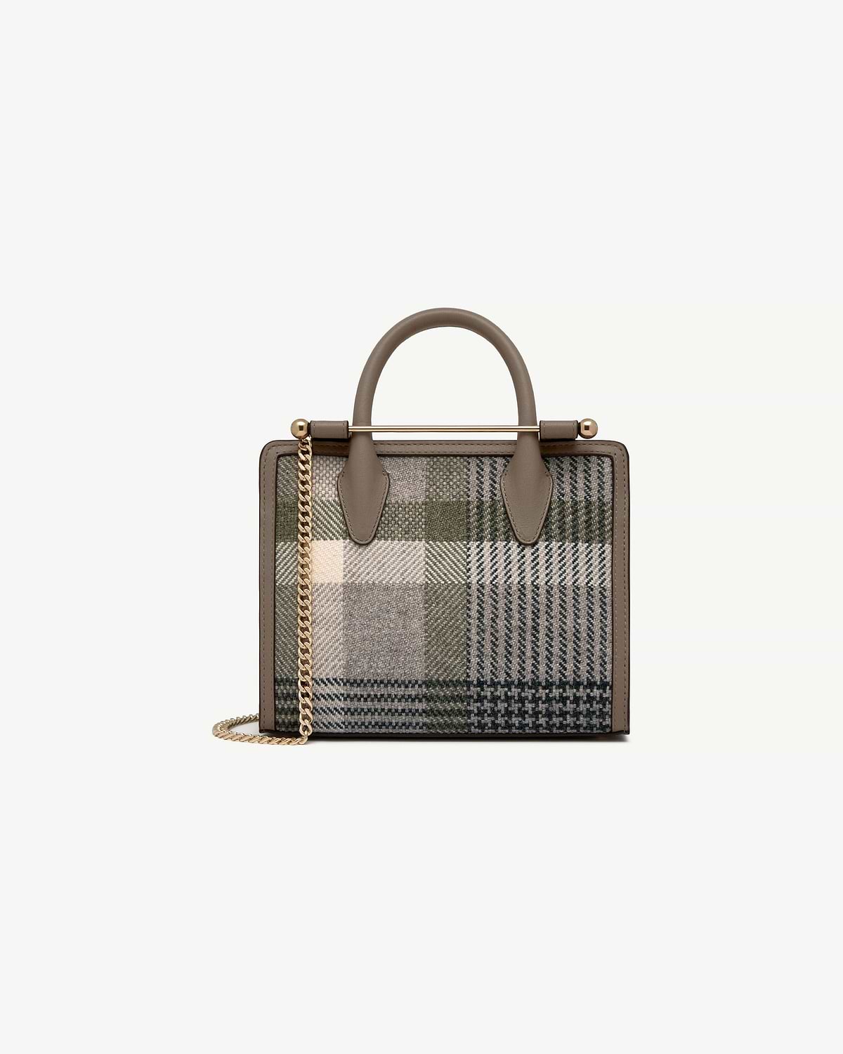 Mini tote with taupe leather trim, tartan fabric, gold bar handle and chain strap.