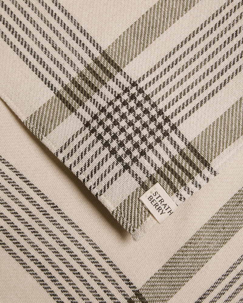 Beige and olive tartan cotton-linen table runner with Strathberry label.