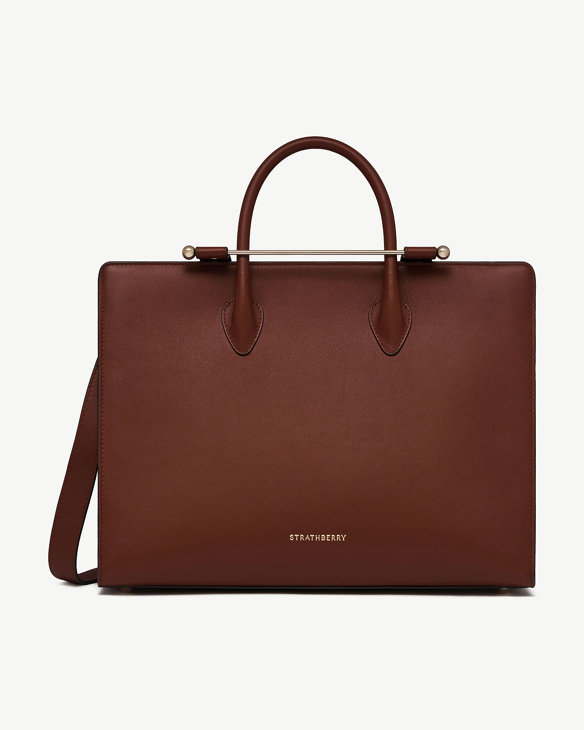 Strathberry walnut leather tote with top handles and shoulder strap.