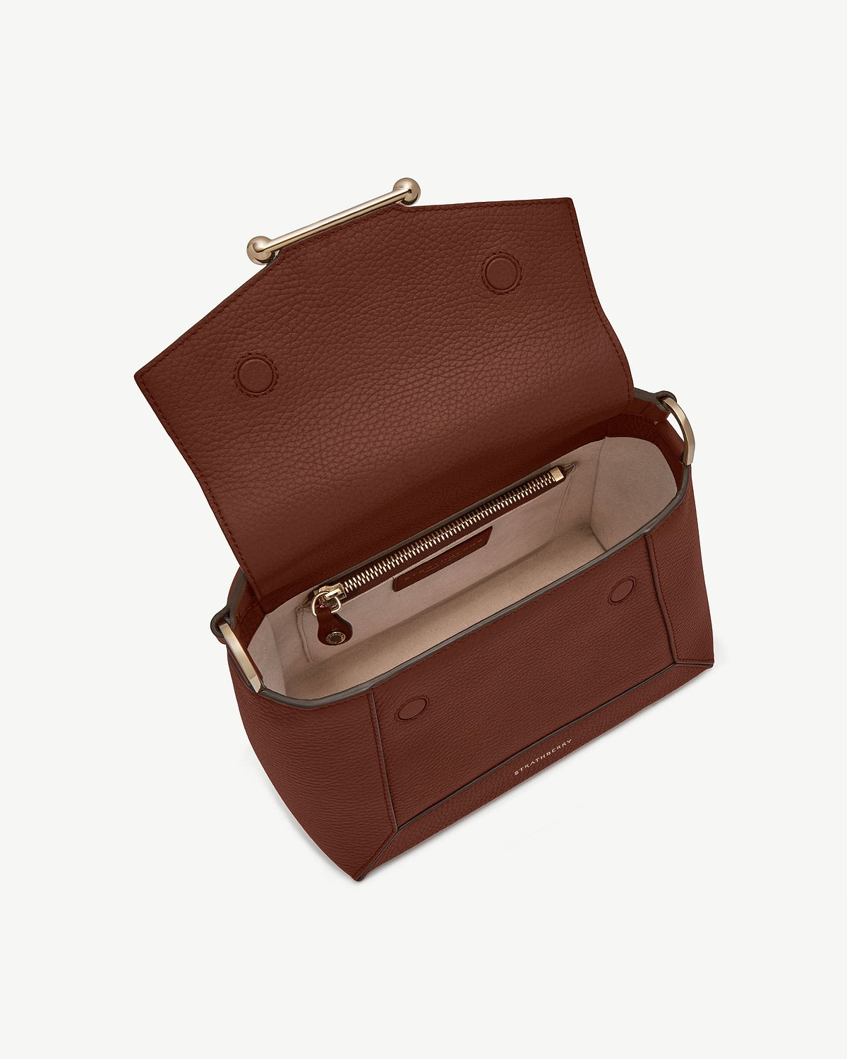 Walnut mosaic bag open, showing pebbled leather exterior and beige interior with zip pocket.