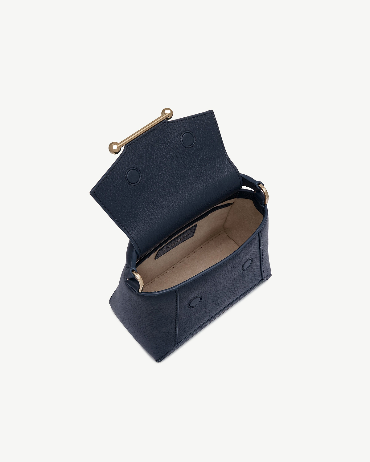 Navy Mosaic Nano bag with open flap showing beige lining and gold bar fastening.