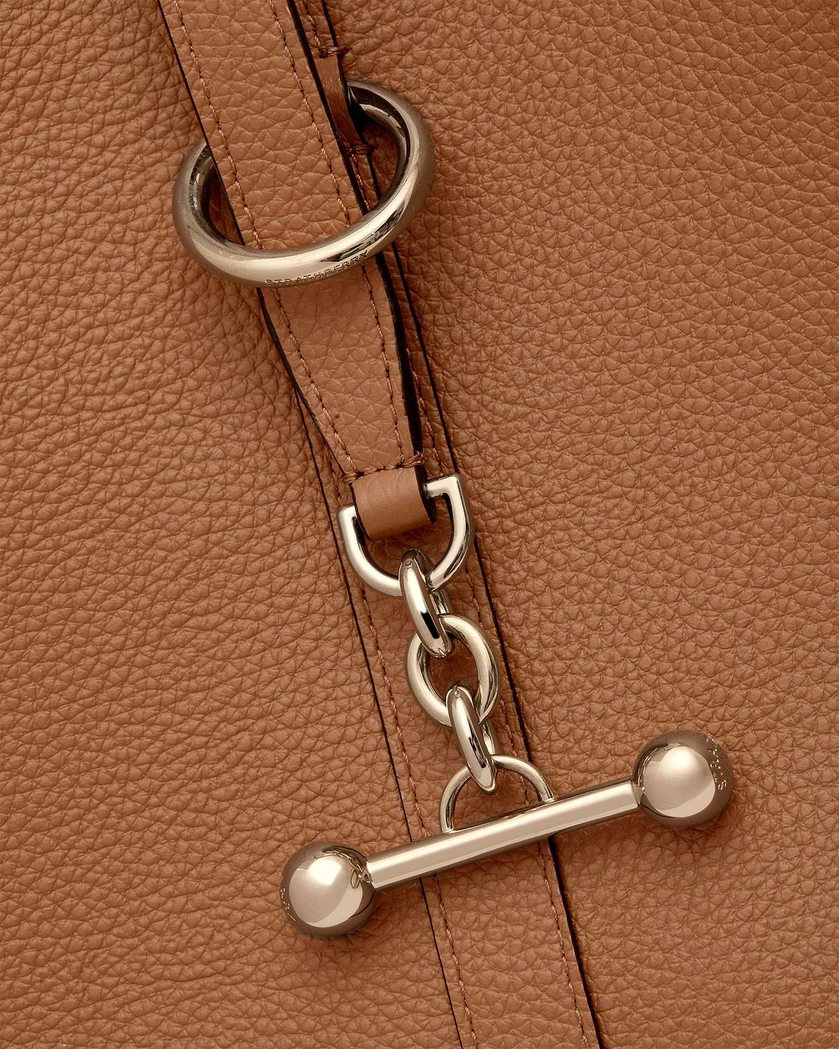 Tan leather tote strap with chain links and Strathberry engraved metal hardware.