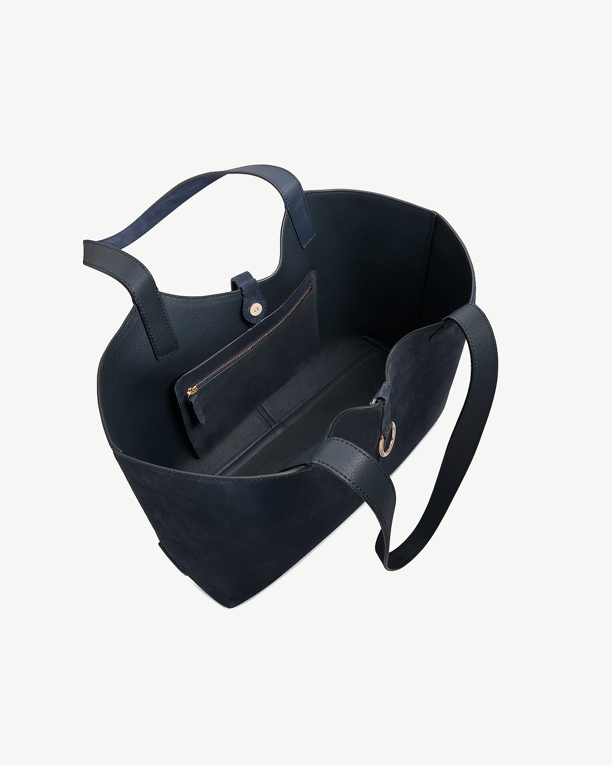 Navy suede Kite tote with open top, interior zip pocket and straps.