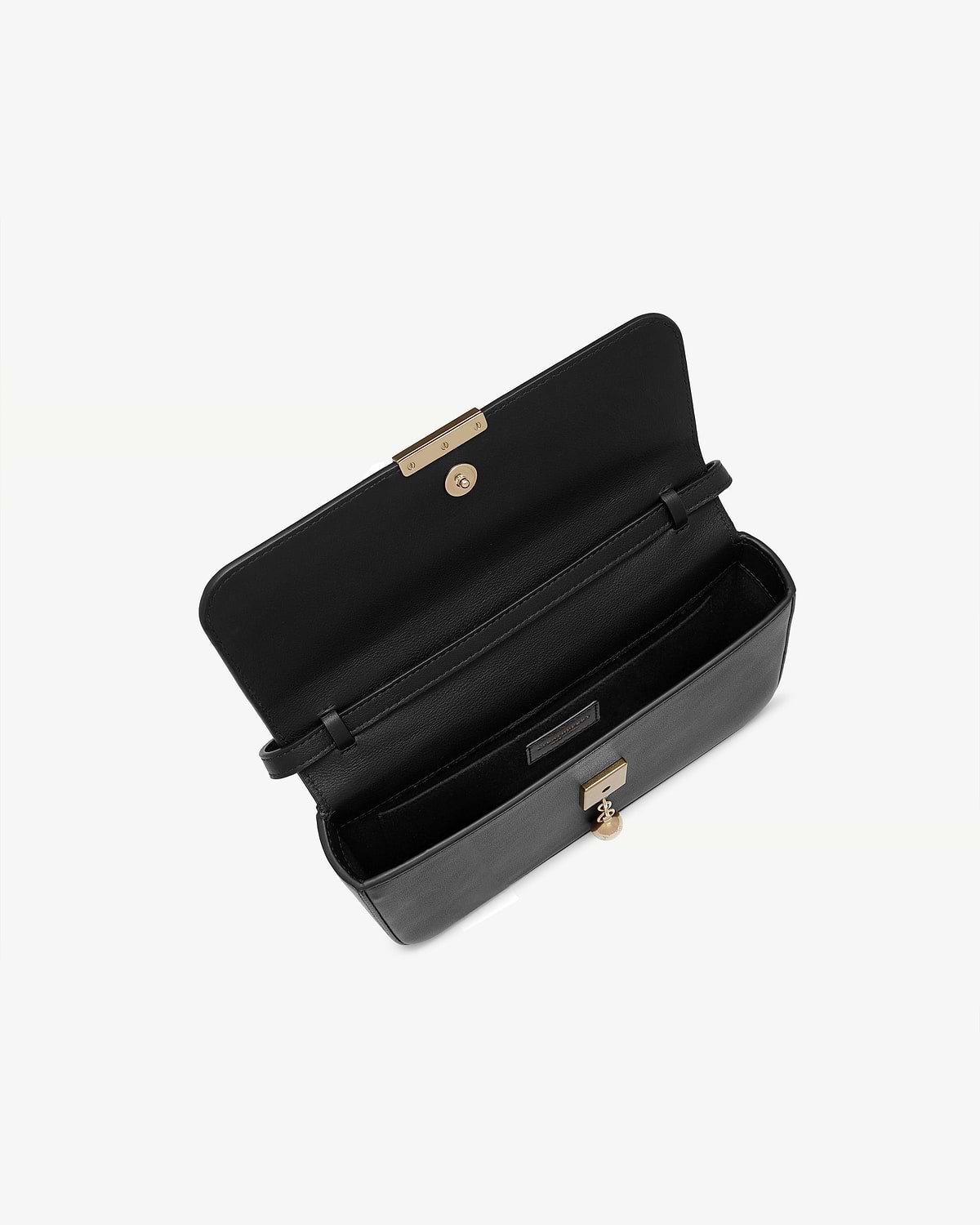 Black leather clutch open showing interior compartments and gold clasp.