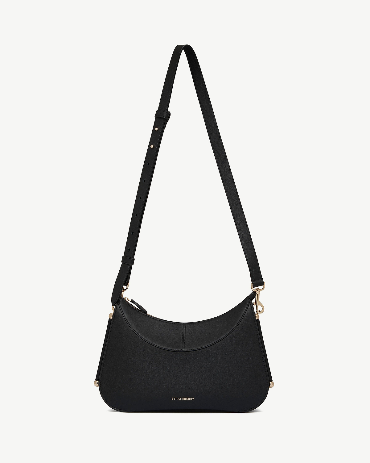 Black Strathberry Nest shoulder bag with adjustable strap and gold hardware.