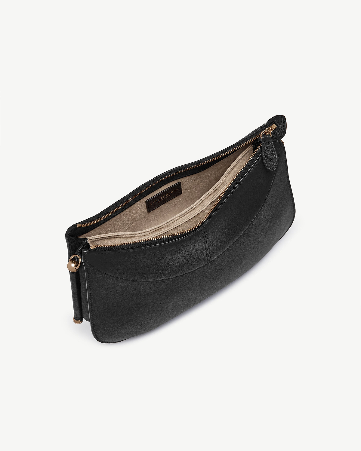 Black Nest Shoulder bag with open top zip, beige interior and Strathberry label.