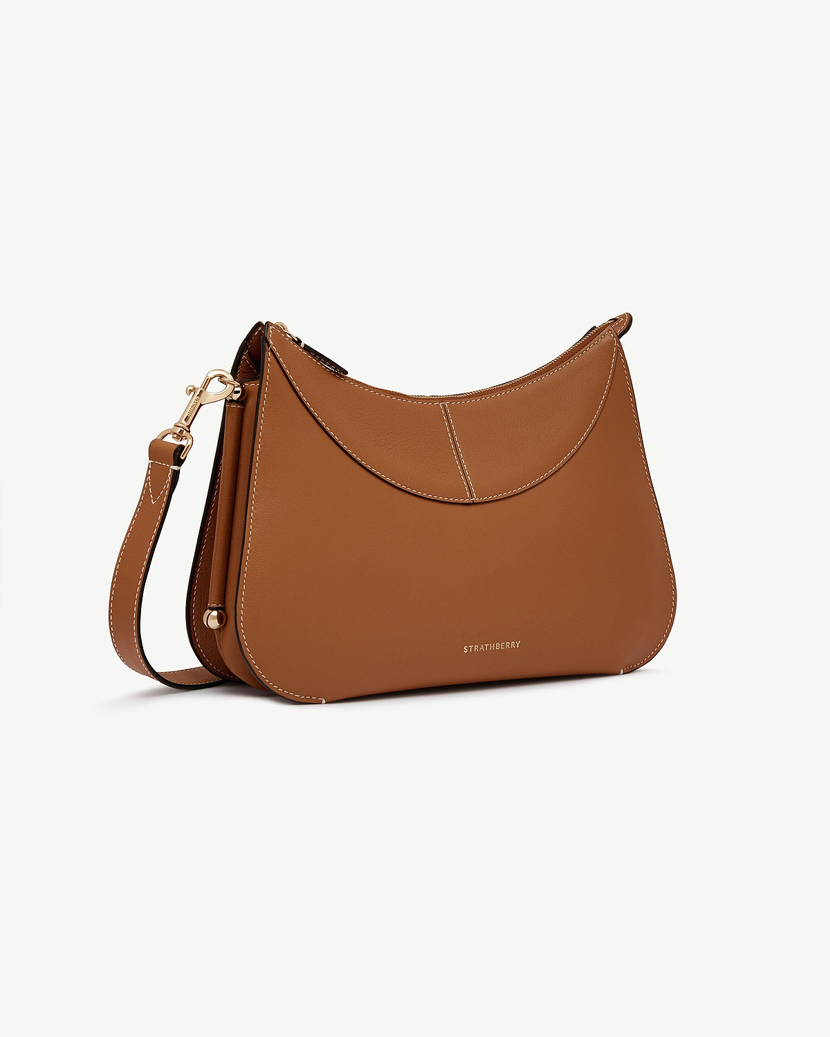 Tan Nest shoulder bag with strap, contrast stitching, gold hardware and Strathberry logo.