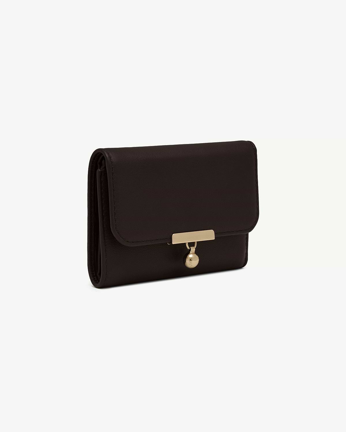 Espresso leather trifold wallet with rectangular gold clasp and round hanging charm.
