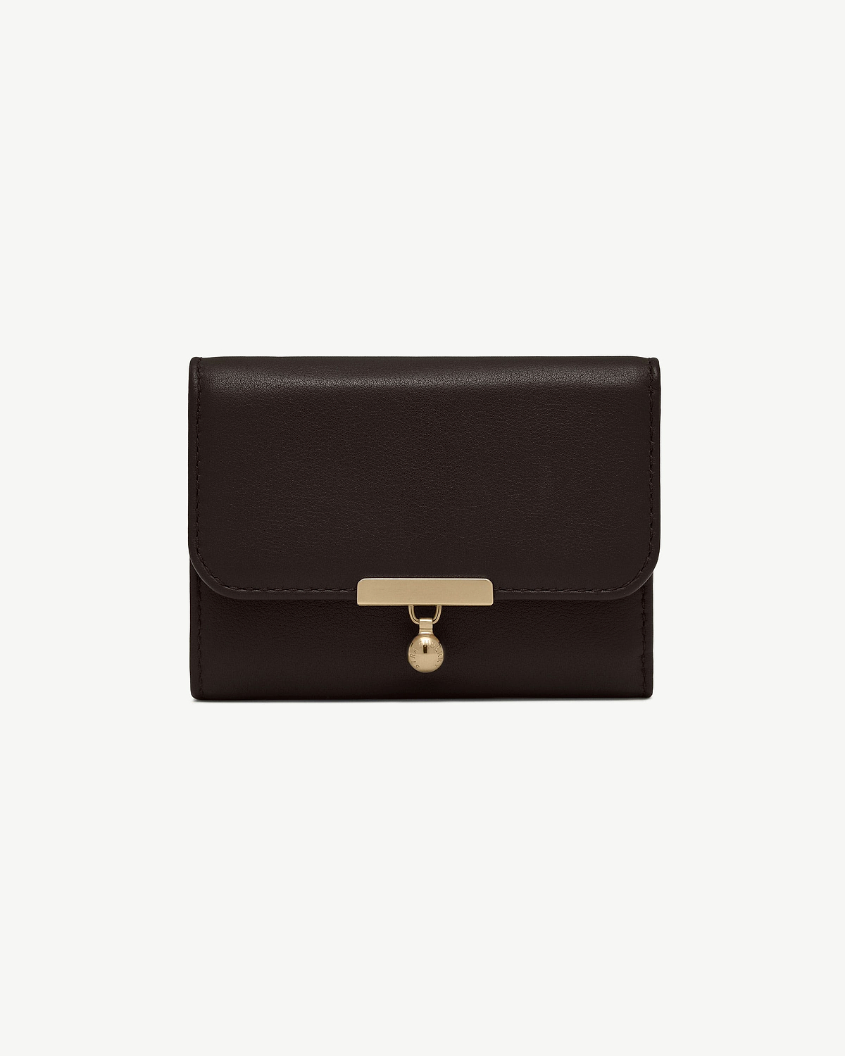 Espresso leather trifold wallet with gold bar clasp and circular charm.