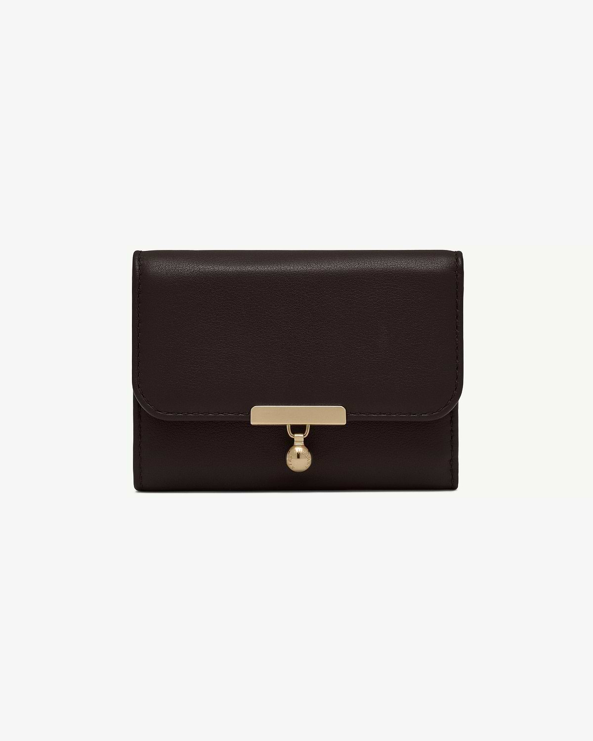Espresso leather trifold wallet with gold bar clasp and circular charm.
