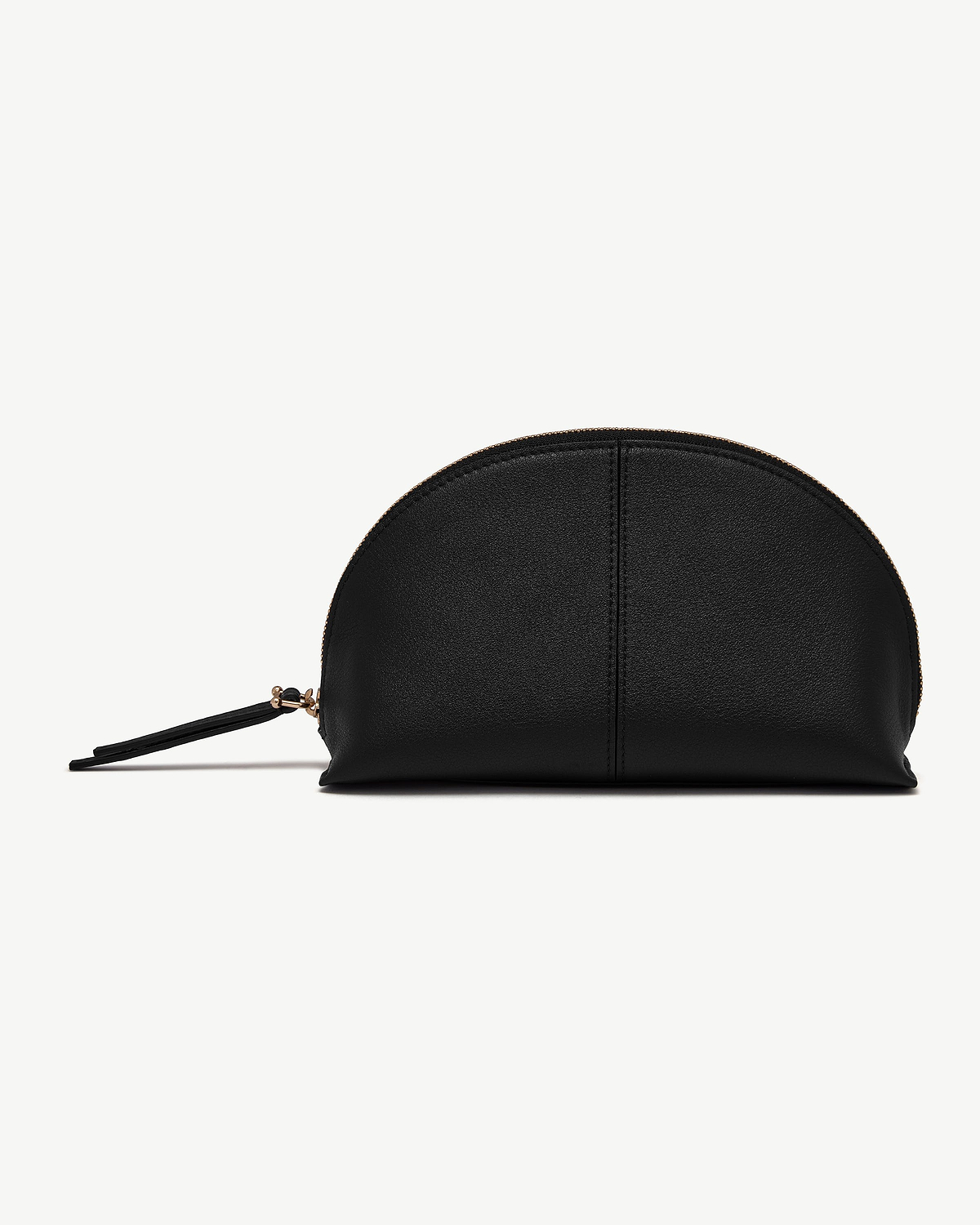 Black semi-circular leather pouch with gold zip and wrist strap on white.