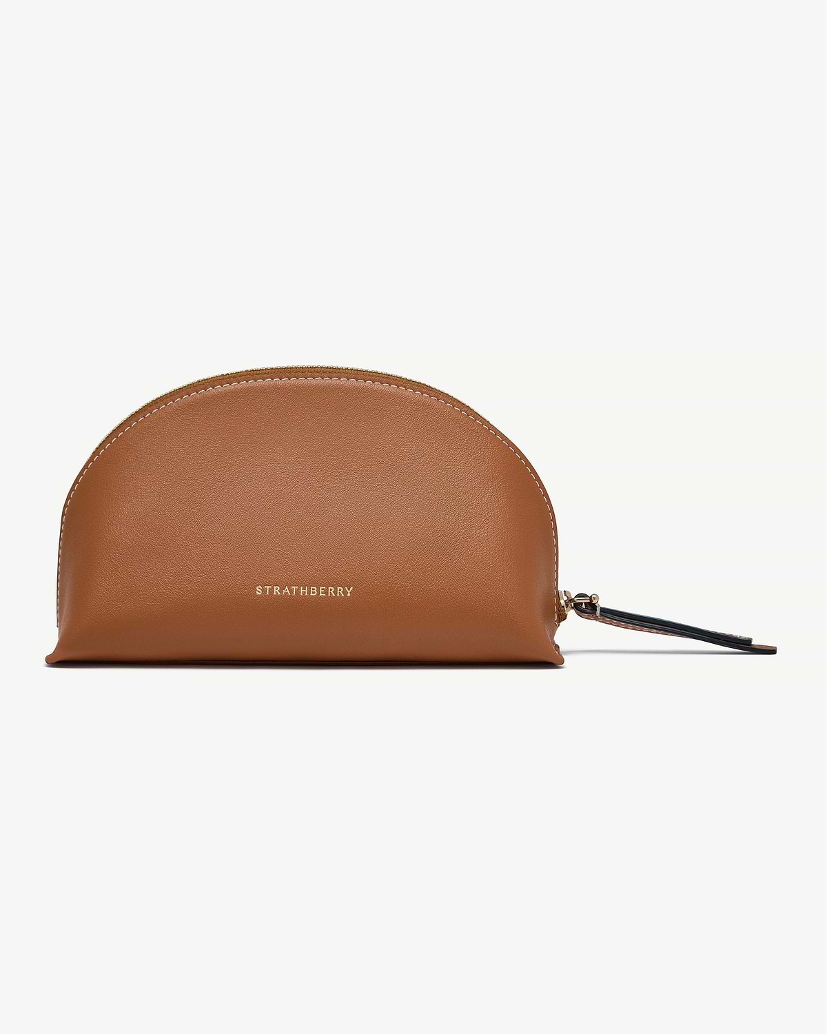 Tan leather Strathberry Nest pouch with gold logo and wrist strap.