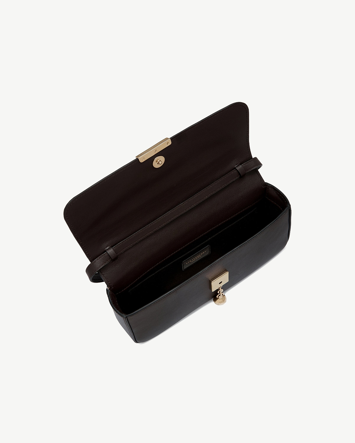 Espresso Strathberry clutch open showing interior, strap and gold push-lock hardware.