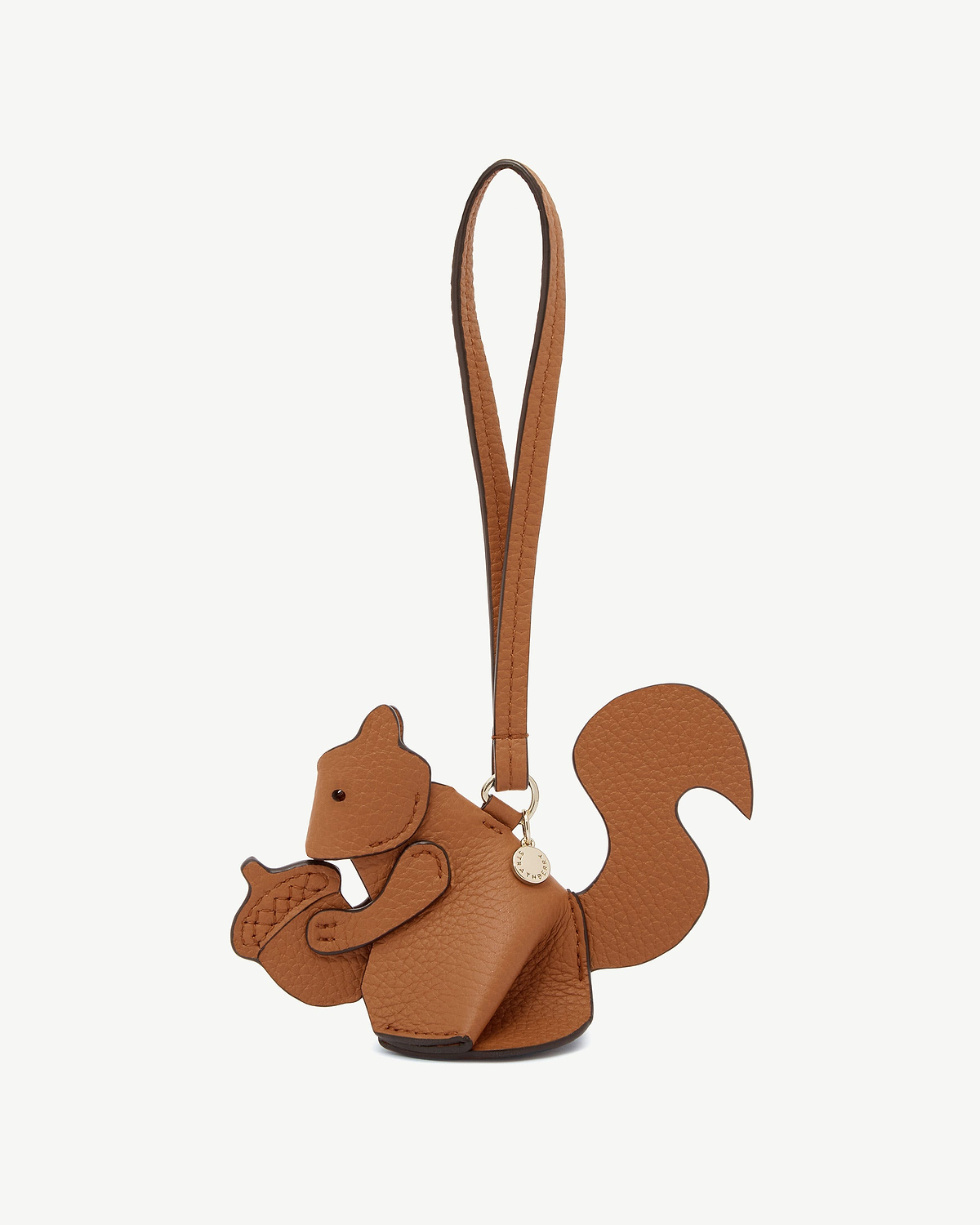 Tan squirrel leather bag charm shaped like a squirrel with strap and gold tag