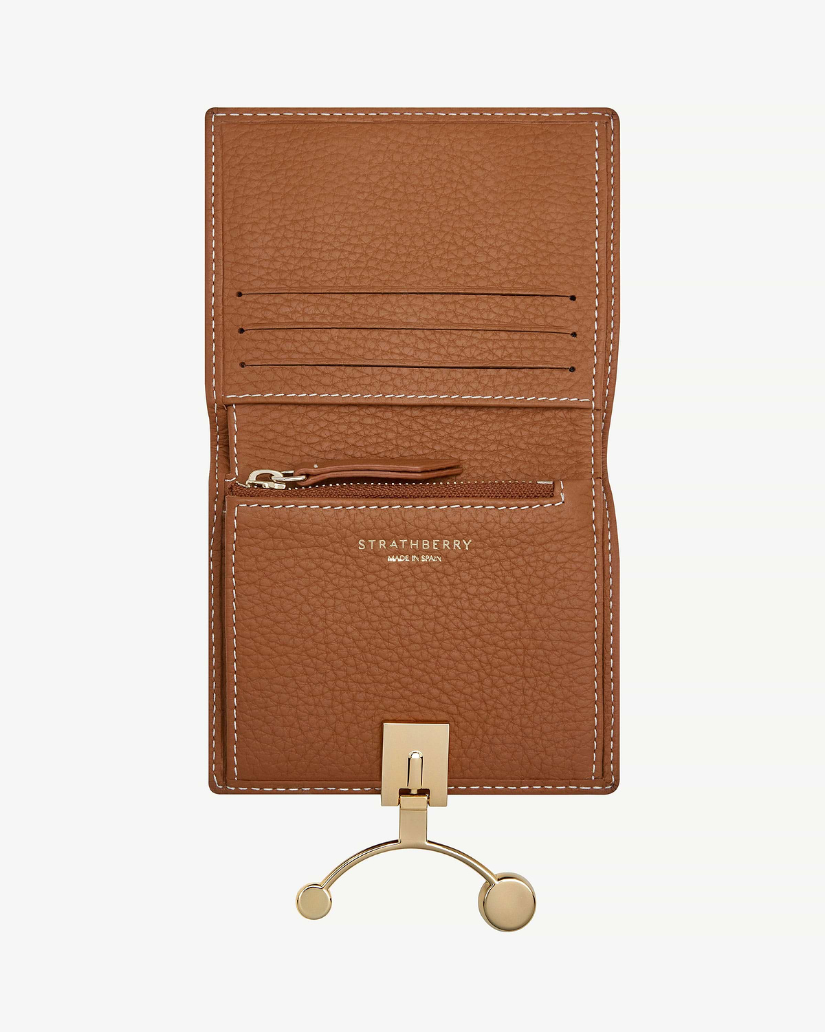 Tan leather crescent wallet open with card slots, zip pocket, vanilla stitching and Strathberry logo.