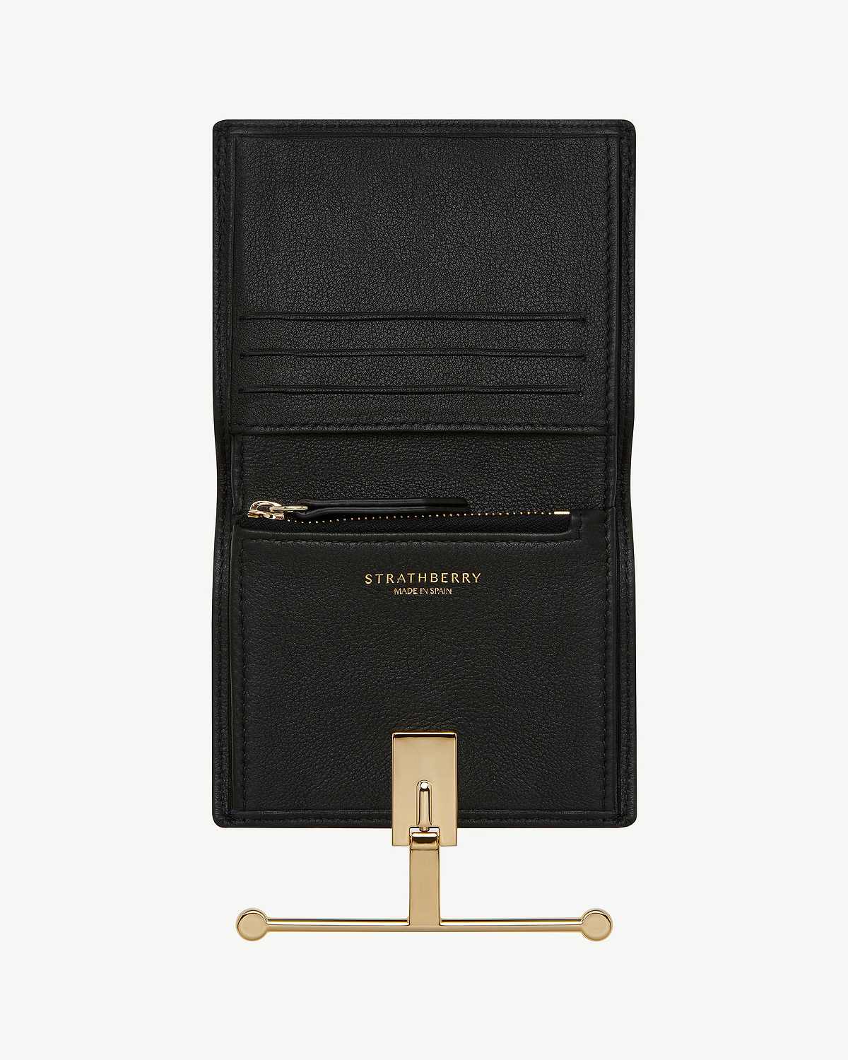 Black Strathberry Melville Street wallet open showing card slots and gold hardware.