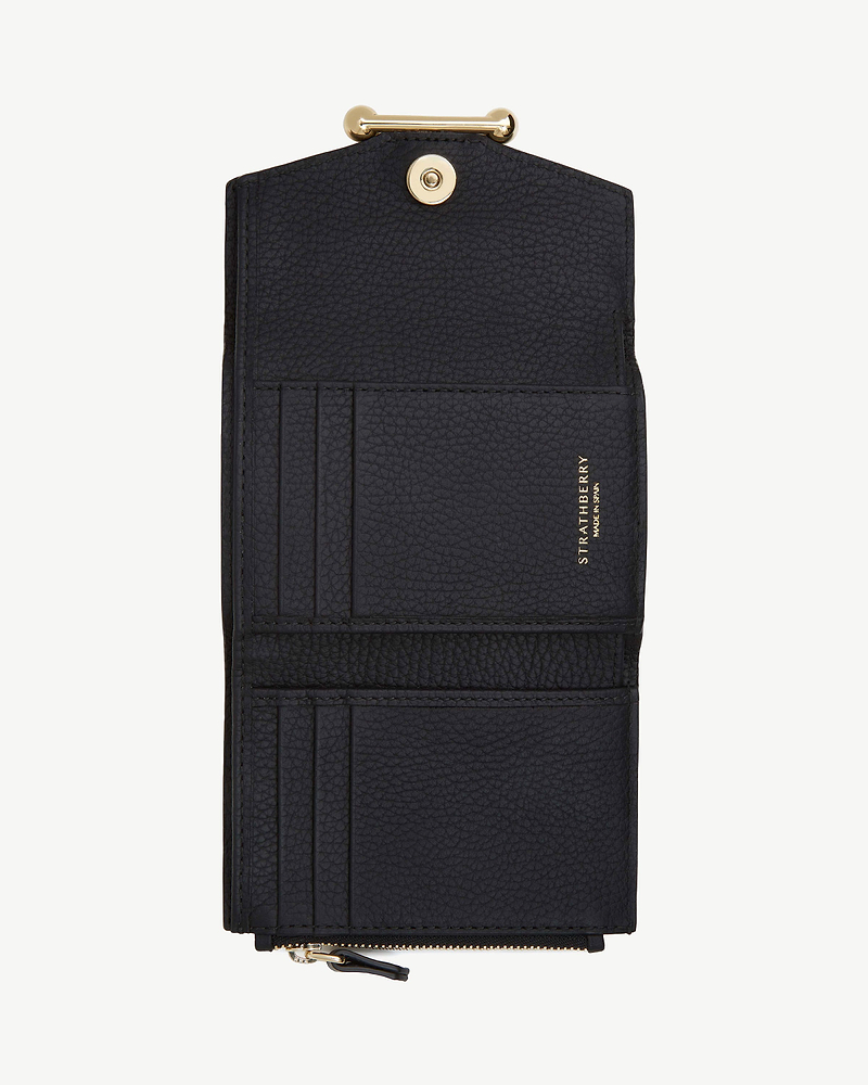 Black Strathberry trifold wallet open, showing card slots and zip pocket.