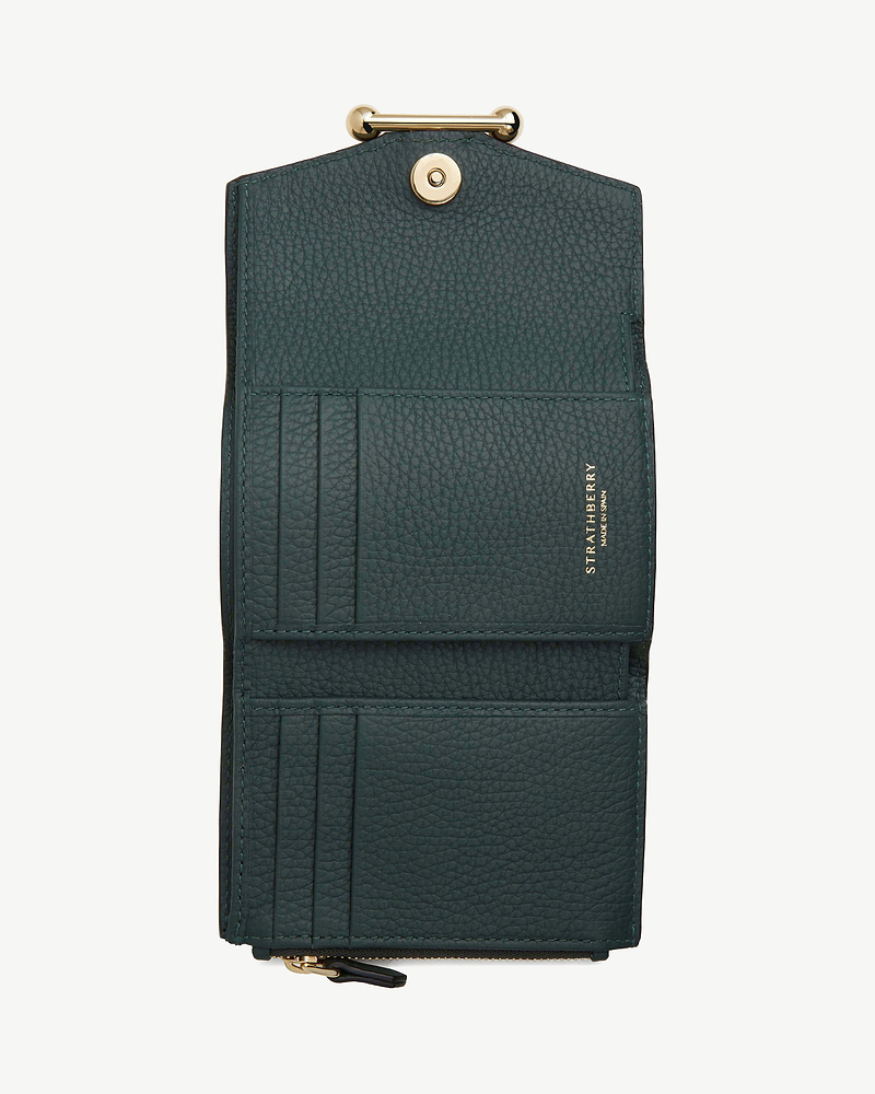 Bottle green Strathberry mosaic trifold wallet open showing card slots and gold hardware.
