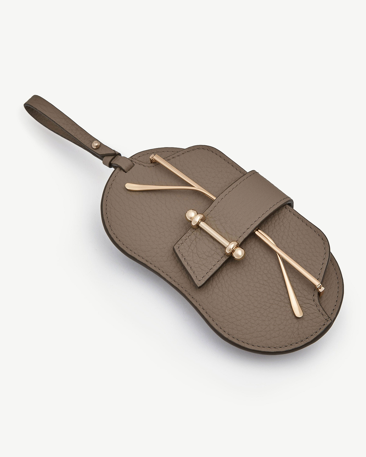 Taupe pebbled leather sunglasses case with gold hardware and wrist strap.