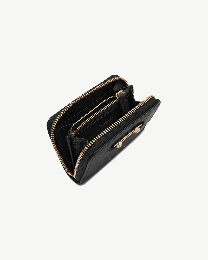 Black Strathberry zip-around wallet with gold zips and internal card compartments