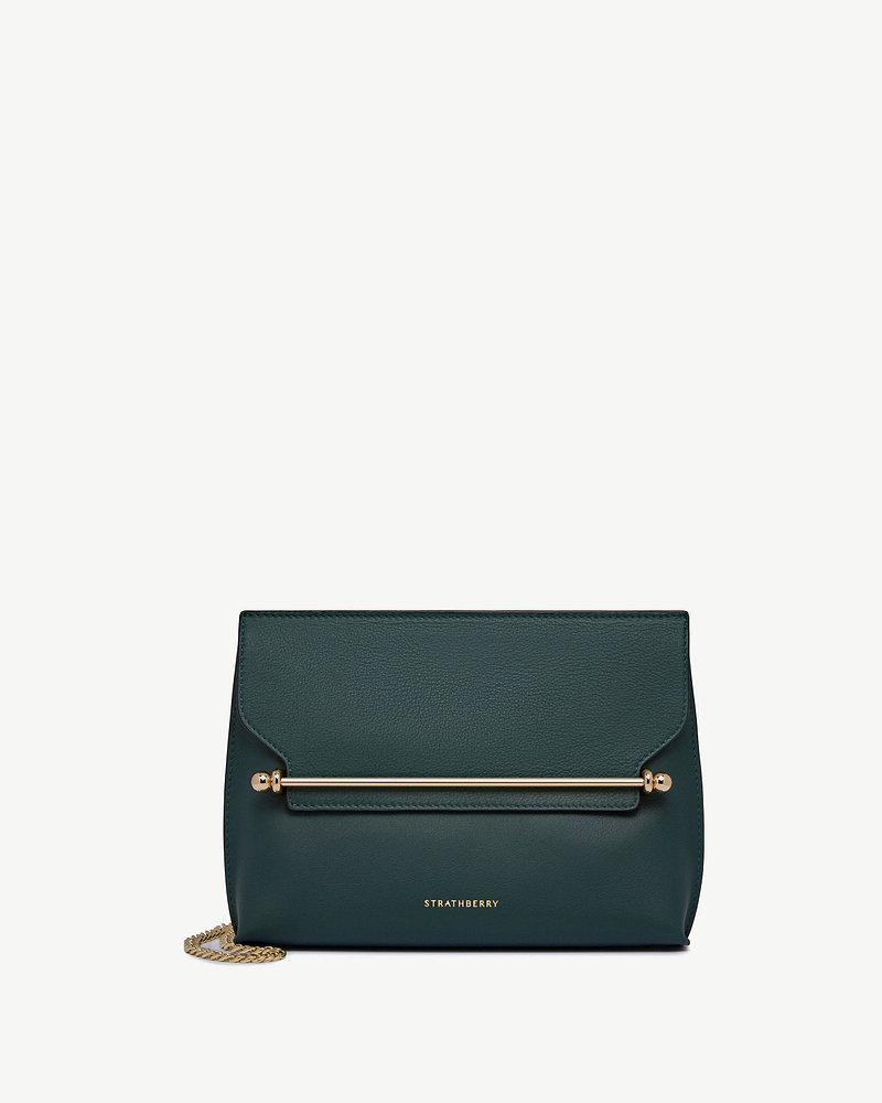 Bottle green Strathberry bag with gold bar detail and chain strap.