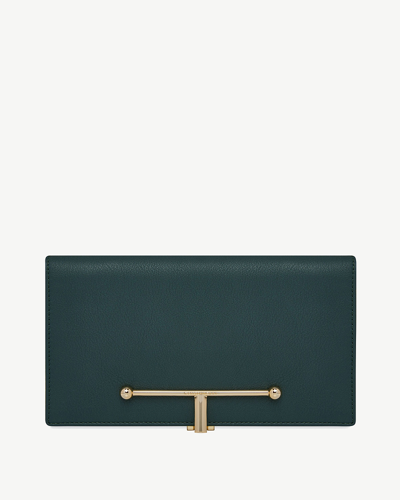 Large bottle green leather wallet with gold T-bar clasp and stitched edge detail.