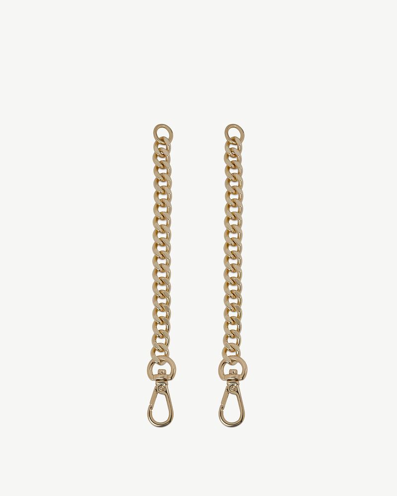 Pair of gold chain extenders with clasp hooks on a white background.