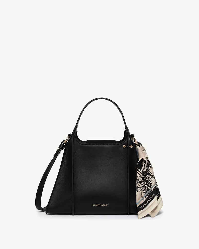 Black Strathberry Arkshell handbag with top handle, shoulder strap and tied scarf.