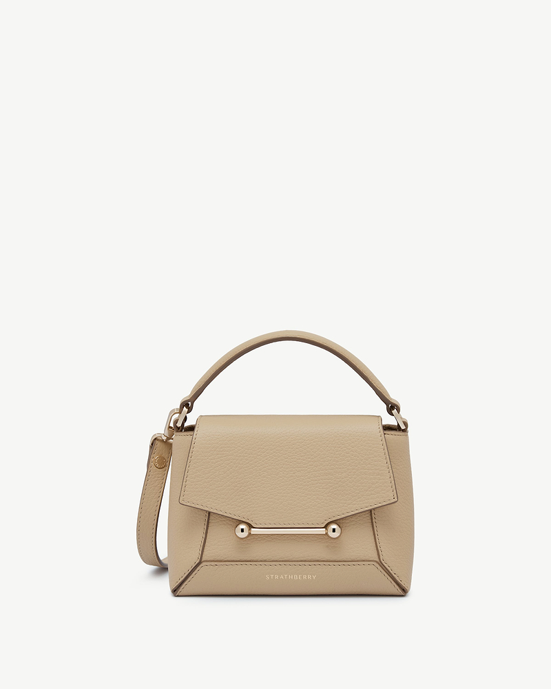 Sand Mosaic Nano bag with top handle and gold bar fastener, Strathberry logo.