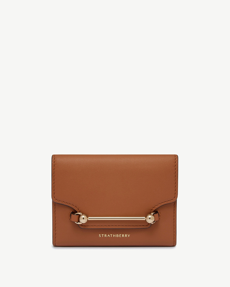 Chestnut Multrees trifold wallet with gold bar hardware and STRATHBERRY logo.