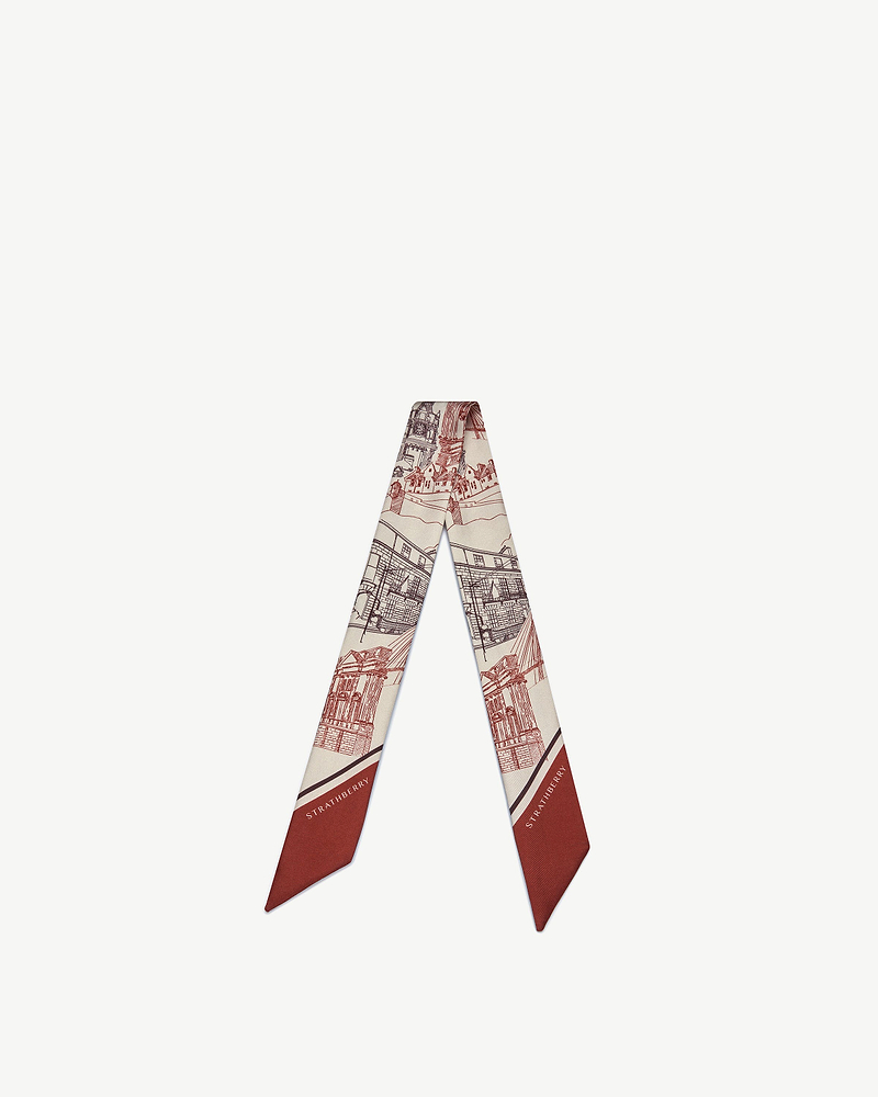 Silk skinny scarf with oxblood burgundy architectural print and Strathberry logo.