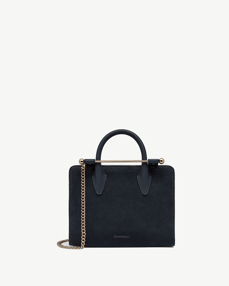 Strathberry mini tote in navy suede with gold chain and bar handle