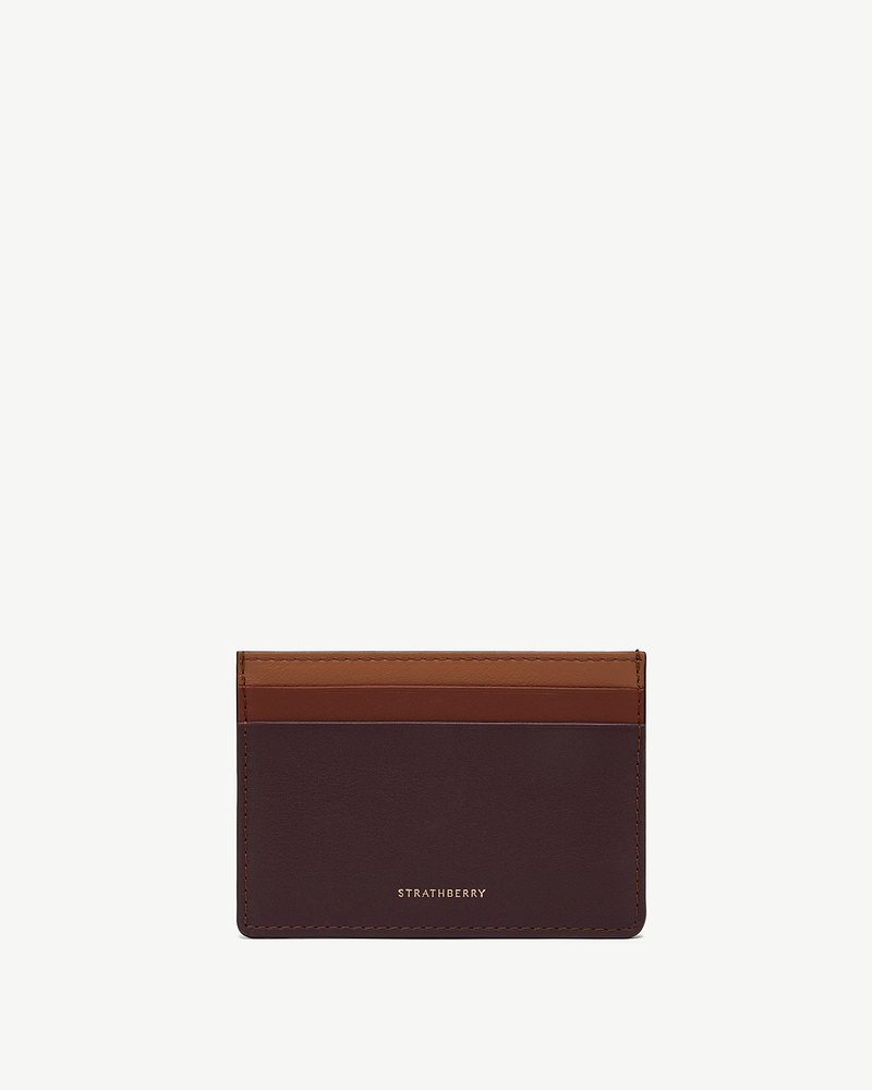 Strathberry cardholder in burgundy, walnut and chestnut leather with stitched edges.