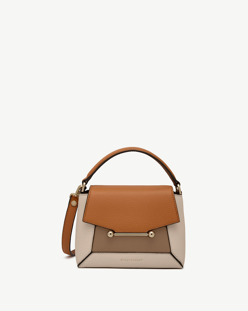 Tricolour oat, honey and clay leather top-handle bag with gold bar closure, Strathberry logo.