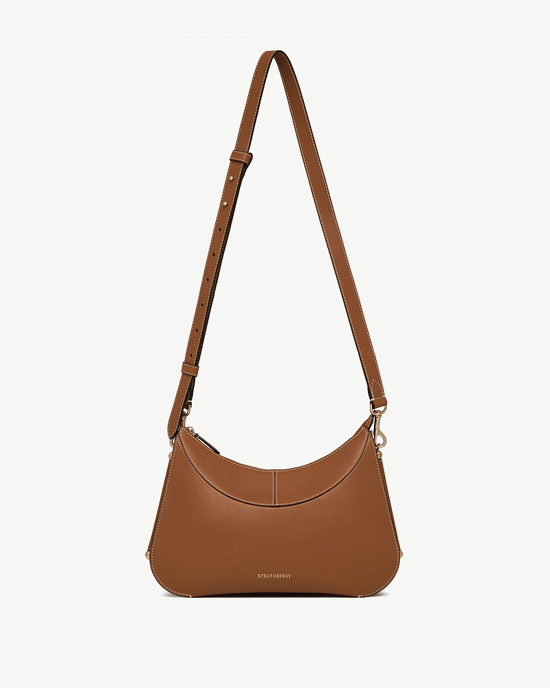 Tan Nest shoulder bag with adjustable strap and Strathberry logo at base.