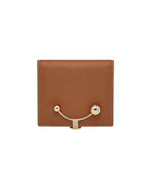 Tan crescent wallet with vanilla stitching and gold crescent clasp