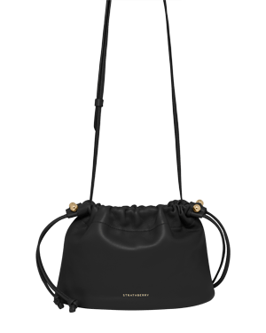 Black Strathberry Charlotte drawstring bag with long shoulder strap and gold studs.