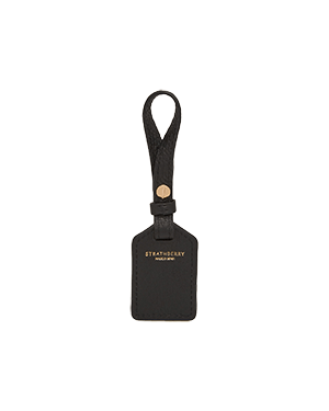 Black Strathberry leather tag with loop strap and gold logo stamp.