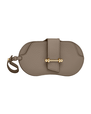 Taupe pebbled leather sunglasses case with strap and gold-tone bar fastening.