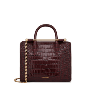 Strathberry mini croc-embossed tote in burgundy with top handle and gold chain.