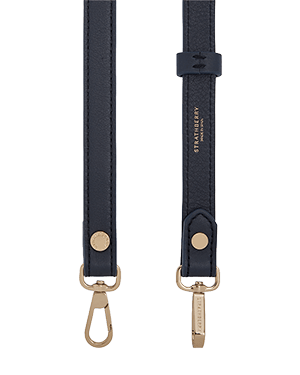 Thin adjustable marine blue leather strap with gold hardware and Strathberry logo.