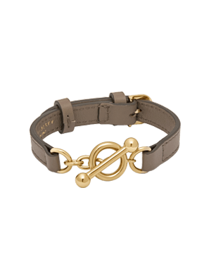 Taupe leather kite bracelet with gold toggle clasp and adjustable strap.