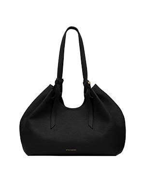 Black textured leather tote bag with long shoulder straps and small gold wordmark.
