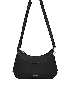 Black Nest shoulder bag with adjustable strap and gold hardware.