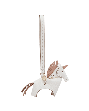 White leather unicorn bag charm with peony pink mane, gold hardware and strap.