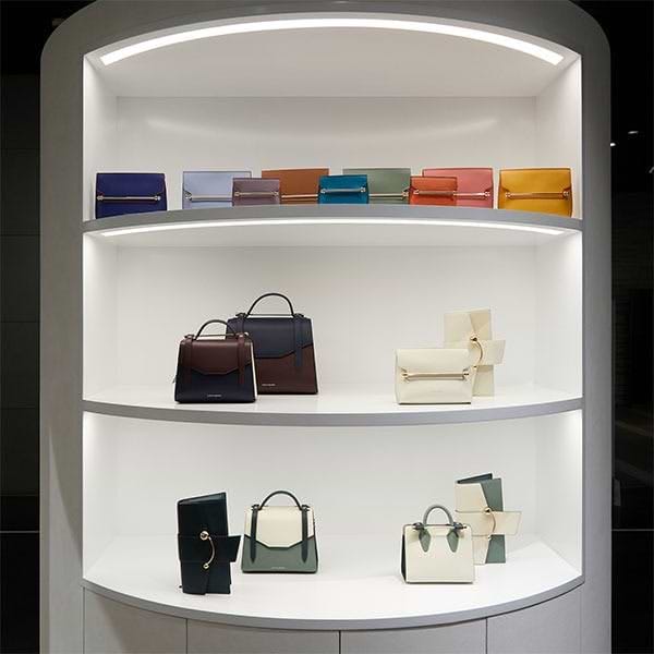 A display of purses and handbags in a store