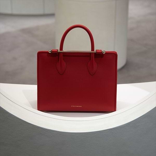 A red purse sitting on top of a table