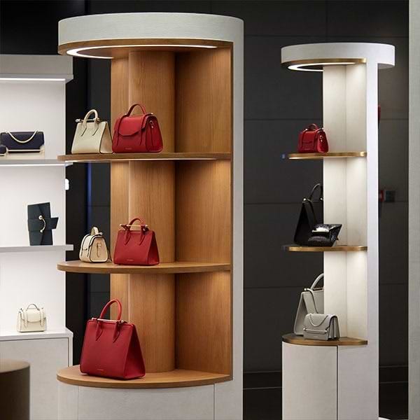 A display of handbags and purses in a store